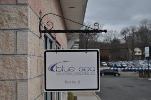 Alpharetta Wayfinding Signs outdoor hanging blade sign blue sea building business wayfinding address sign 300x199